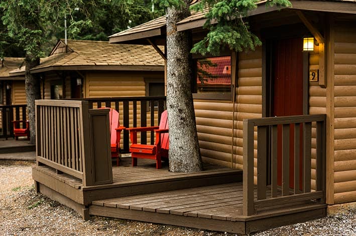 Two chairs on the outdoor deck of a cabin