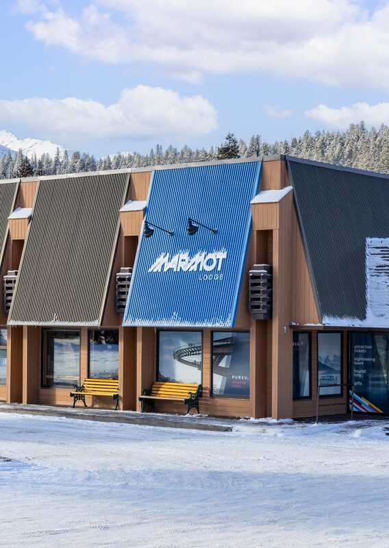 Snowy exterior of Marmot Lodge