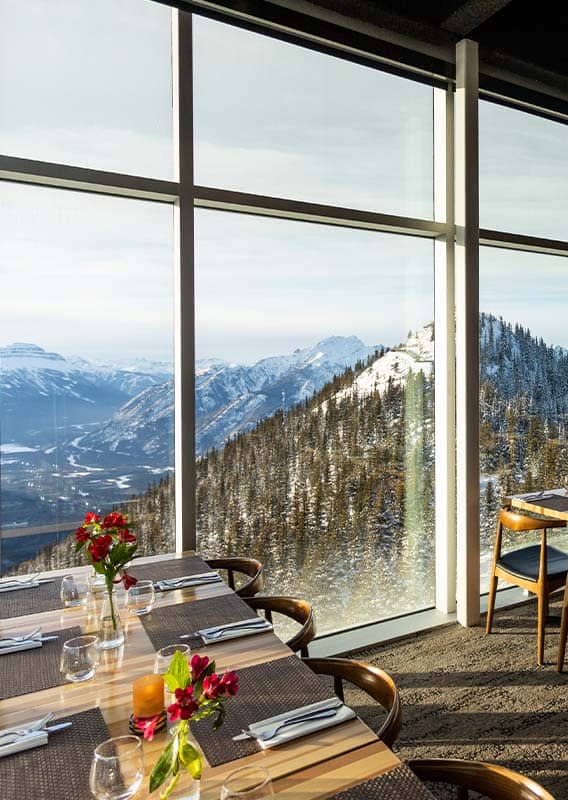 A restaurant dining room and bar with rustic decor.