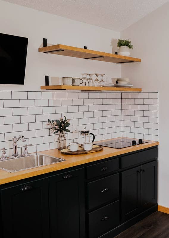 A white tiled kitchenette