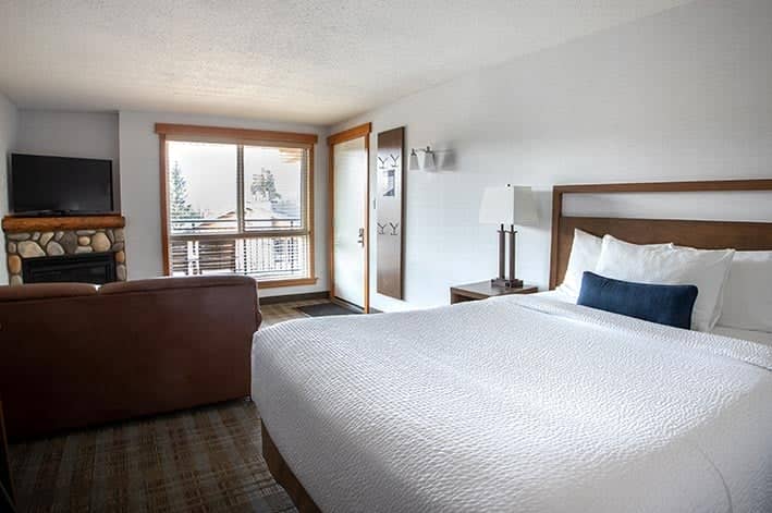 One queen room with a fireplace at Pyramid Lake Lodge.