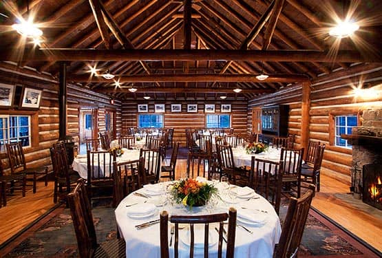 The interior of a rustic wooden cabin dining room