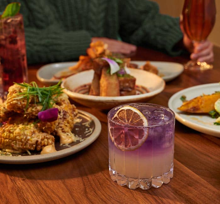 A dinner table with plates and drinks.