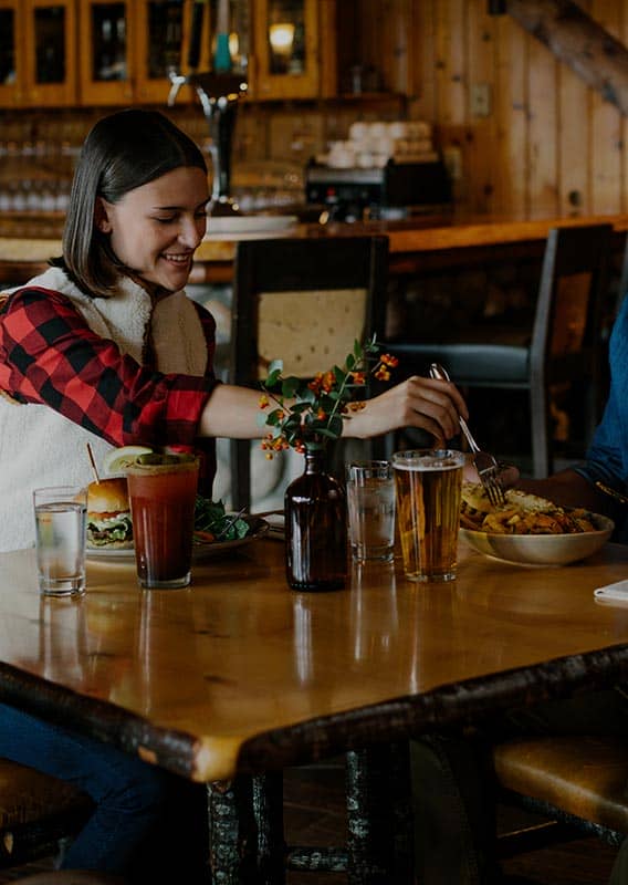 Two people at a table for dinner.