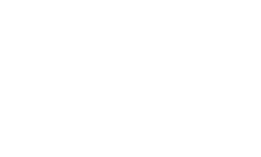 Glacier View Lodge guest lounge with fireplace and floor to ceiling view of the Columbia Icefield